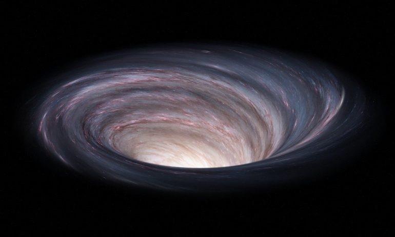 Descubren el agujero negro más grande del universo